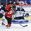 PLYMOUTH, MICHIGAN - APRIL 6: Canada's Jennifer Wakefield #9 with a scoring chance against Finland's Noora Raty #41 during semifinal round action at the 2017 IIHF Ice Hockey Women's World Championship. (Photo by Matt Zambonin/HHOF-IIHF Images)

